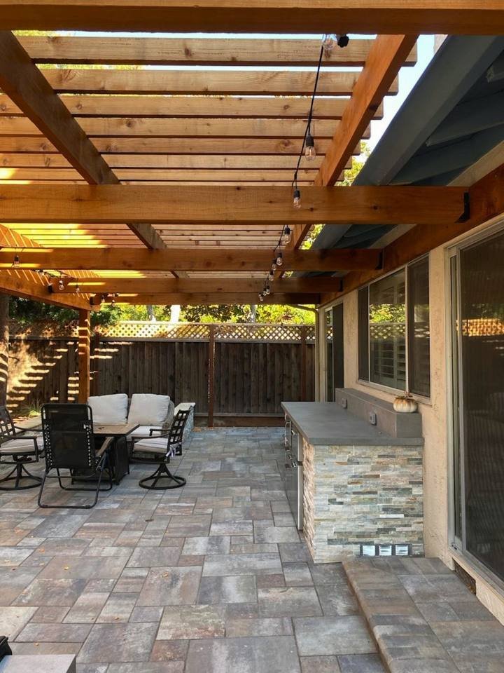 Attached pergola with outdoor kitchen